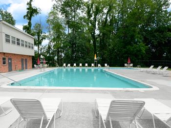 Pool with chairs at Painters Mill Apartments, Randallstown
